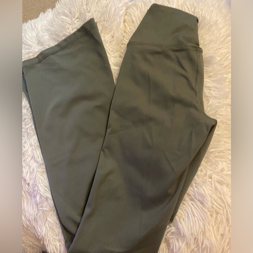 Green flared leggings